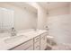 Clean bathroom with dual sinks, a large mirror, and a shower-tub combination at 5735 Olive Beach Rd, Kannapolis, NC 28081