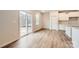 Bright dining area with sliding glass doors leading to a patio, adjacent to the kitchen at 5735 Olive Beach Rd, Kannapolis, NC 28081