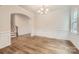 Elegant dining room with hardwood floors, chair rail molding, and a stylish chandelier at 5735 Olive Beach Rd, Kannapolis, NC 28081