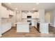 Open concept kitchen with white cabinets, quartz countertops, stainless steel appliances, and a central island at 5735 Olive Beach Rd, Kannapolis, NC 28081