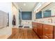 This modern bathroom features wood cabinets, tile floors, and a soaking tub at 6017 Rose Valley Dr, Charlotte, NC 28210