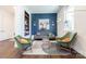 Cozy sitting area with a blue accent wall and eclectic decor for comfortable living at 6017 Rose Valley Dr, Charlotte, NC 28210