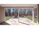 Covered patio with a stone patio area with trees in the background and outdoor grill at 6055 Brush Crk, Monroe, NC 28110