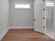 Modern bathroom featuring hardwood floors, walk-in shower, and bright lighting at 6055 Brush Crk, Monroe, NC 28110