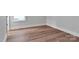 Bedroom with hardwood floors, baseboard molding, and a large window at 6055 Brush Crk, Monroe, NC 28110