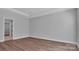 A clean bedroom featuring hardwood floors, and plenty of sunlight at 6055 Brush Crk, Monroe, NC 28110