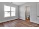 Bedroom with hardwood floors next to an attached bathroom and shower at 6055 Brush Crk, Monroe, NC 28110