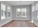 Dining room with wood flooring, chandelier, neutral walls and large windows providing natural light at 6055 Brush Crk, Monroe, NC 28110