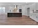 A full kitchen view with an island, pendant lighting, and stainless steel appliances at 6055 Brush Crk, Monroe, NC 28110