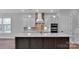 Modern kitchen with stone countertops, pendant lighting, and stainless steel double ovens at 6055 Brush Crk, Monroe, NC 28110