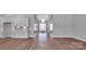 Open concept living area featuring a kitchen and view down the elegant hallway at 6055 Brush Crk, Monroe, NC 28110