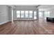 Spacious living room featuring lots of natural light and attractive hardwood floors at 6055 Brush Crk, Monroe, NC 28110