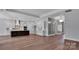 Open-concept living space with hardwood floors, a modern kitchen and stylish design at 6055 Brush Crk, Monroe, NC 28110