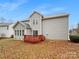 Backyard featuring a wooden deck, mature trees, and a lawn at 609 Sunset Point Dr, Rock Hill, SC 29732