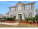 Charming two-story home featuring green shutters, mature landscaping, and a welcoming entrance at 609 Sunset Point Dr, Rock Hill, SC 29732