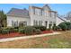 Charming two-story home with green shutters, a manicured front yard, and a well-maintained walkway at 609 Sunset Point Dr, Rock Hill, SC 29732