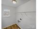 Laundry room including a wire rack for storage and washer-dryer hookups at 609 Sunset Point Dr, Rock Hill, SC 29732
