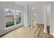 Bright living room with hardwood floors, white pillars, and large windows at 609 Sunset Point Dr, Rock Hill, SC 29732