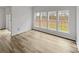 Bright living room with beautiful flooring, fresh white paint, and large windows offering plenty of natural light at 609 Sunset Point Dr, Rock Hill, SC 29732