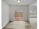 Bright living room featuring a sliding glass door leading to an outdoor deck, perfect for indoor-outdoor living at 609 Sunset Point Dr, Rock Hill, SC 29732