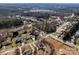 Aerial view displays neighborhood homes with spacious lots and mature trees, revealing the community layout at 662 Georgie St, Troutman, NC 28166