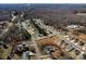 An aerial shot presents the neighborhood and reveals the layout of the surrounding homes and streets at 662 Georgie St, Troutman, NC 28166
