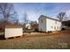 Large backyard with a storage shed and garden area, perfect for outdoor activities at 662 Georgie St, Troutman, NC 28166
