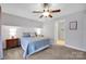 Comfortable bedroom with a ceiling fan, a large bed and nightstand at 662 Georgie St, Troutman, NC 28166