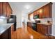 Bright kitchen features granite countertops, wood cabinets and stainless steel appliances at 662 Georgie St, Troutman, NC 28166