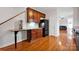 Functional kitchen area with hardwood floors, cabinets, granite countertops, and modern appliances at 662 Georgie St, Troutman, NC 28166