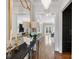 Inviting entryway with hardwood floors, stylish decor, and an elegant chandelier at 6711 Conservatory Ln, Charlotte, NC 28210