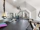 Bright home gym featuring mirrors, gym equipment, and rubber flooring for effective fitness routines at 6711 Conservatory Ln, Charlotte, NC 28210