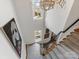 Elegant staircase with patterned carpet, chandelier, and natural light from windows at 6711 Conservatory Ln, Charlotte, NC 28210