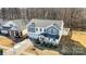 Aerial view of a charming two-story home with a well-manicured lawn and driveway at 7535 Meridale Forest Dr # 107, Charlotte, NC 28269