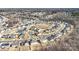 Aerial view of a neighborhood featuring neatly arranged houses and tree lined streets during winter at 7535 Meridale Forest Dr # 107, Charlotte, NC 28269