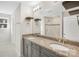 Bathroom with double vanity, granite counters and tile shower at 7535 Meridale Forest Dr # 107, Charlotte, NC 28269