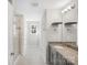 Bathroom featuring a glass shower, vanity, and tile flooring at 7535 Meridale Forest Dr # 107, Charlotte, NC 28269