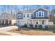 Inviting two-story home with a covered front porch and well-maintained lawn at 7535 Meridale Forest Dr # 107, Charlotte, NC 28269