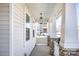 Welcoming front porch with stone accents and a hanging light fixture at 7535 Meridale Forest Dr # 107, Charlotte, NC 28269