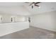 Bright, open loft area features vaulted ceilings and neutral carpeting at 7535 Meridale Forest Dr # 107, Charlotte, NC 28269