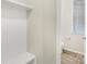 Functional mudroom area with built-in storage and a conveniently located half bathroom at 7535 Meridale Forest Dr # 107, Charlotte, NC 28269