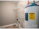 Utility room with a water heater and shelving system at 810 E Main St, Maiden, NC 28650