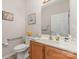 Bright bathroom with a single sink vanity, accessible grab bar, and a clean, simple design at 864 Ledgestone Ct, Tega Cay, SC 29708