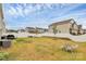 Large backyard with a white fence, a grill and an outdoor dining table and chairs at 9203 Mackinaw Dr, Gastonia, NC 28056
