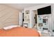 Cozy bedroom featuring an accent wall, vanity, and doorway to the bathroom at 9203 Mackinaw Dr, Gastonia, NC 28056