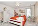 Stylish bedroom with a comfy bed, decorative swing chair, white walls, and carpeted floors at 9203 Mackinaw Dr, Gastonia, NC 28056