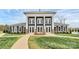 Community clubhouse featuring elegant columns, stone accents, and a welcoming entrance for gatherings and events at 9203 Mackinaw Dr, Gastonia, NC 28056