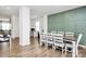 Spacious dining area featuring modern decor, seating for eight, and hardwood flooring at 9203 Mackinaw Dr, Gastonia, NC 28056