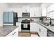 Well-equipped kitchen with stainless steel appliances, granite countertops, and plenty of cabinet space at 9203 Mackinaw Dr, Gastonia, NC 28056