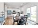 Bright kitchen and dining area featuring modern cabinets, stainless steel appliances, and sliding glass doors at 9203 Mackinaw Dr, Gastonia, NC 28056